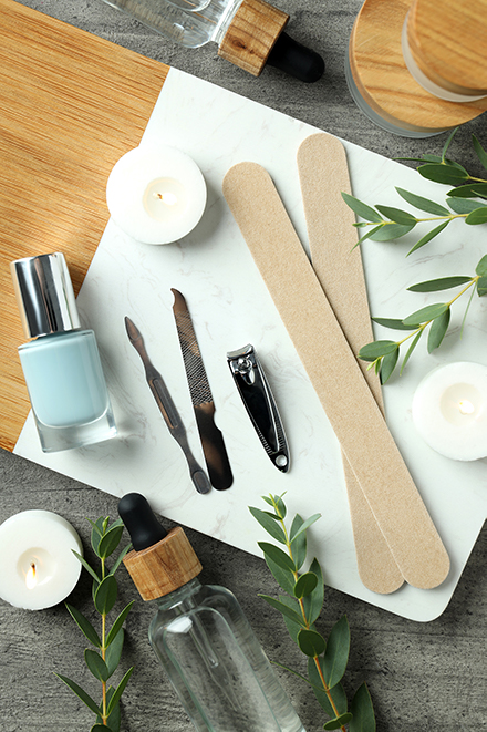 Inicio 2 concept of nail care with manicure accessories on wooden background